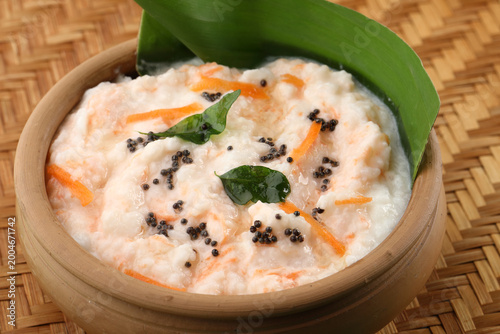 Bild auf Leinwand Carrot Curd rice served in a banana leaf and earthen pot