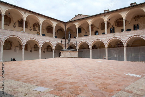 Courtyard of the Sacred Convent part of the Basilica of Saint Francis of Assisi complex. Umbria, Italy. HORIZONTAL
