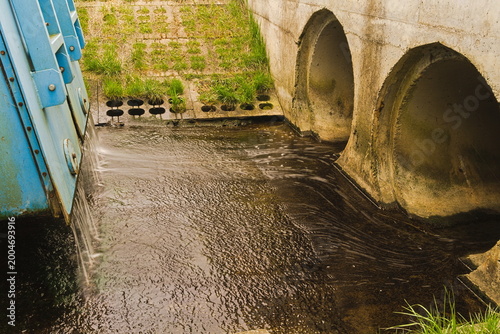 Принти на полотні Water Flowing from Sluice Gate into Concrete Drainage Channel