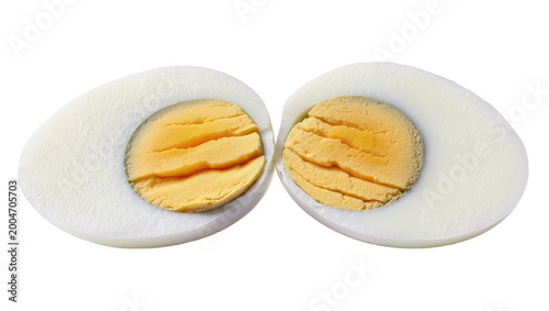 Konstfotografi Two halves of a hard-boiled egg showing white albumen and yellow yolk, isolated