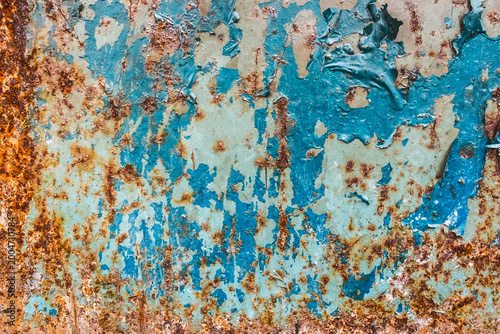 Old peeling blue paint weathered dirty worn rusty obsolete metal texture messy background rust steel