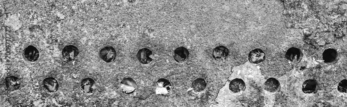 Obraz na plátně Texture old weathered worn messy obsolete dirty barbecue round gray holes patter