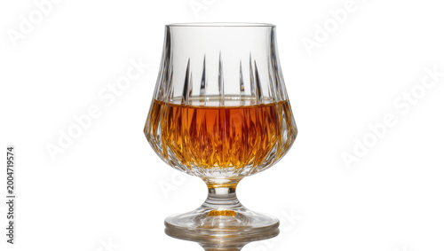 Tableau sur toile Crystal brandy snifter with amber liquid, isolated on transparent background