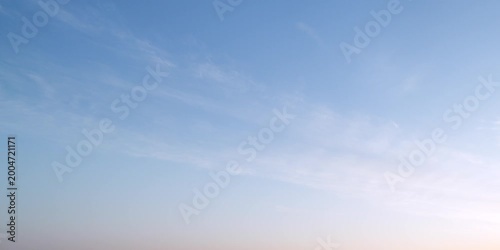 Cloudscape, Timelapse of Soft Cirrus Clouds in a Blue Sky During Sunrise for Background and Backdrop