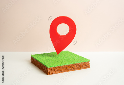 Photography A plot of land with a red geolocation marker