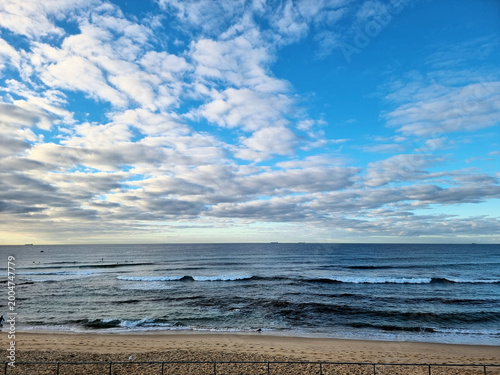 Bar Beach under a cloudy sky early in the morning. Newcastle, Australia