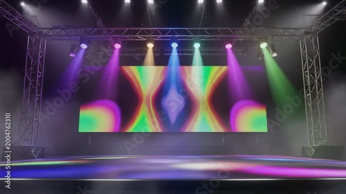 Empty concert stage with vibrant LED screen displaying abstract patterns and colorful spotlights illuminating the smoky atmosphere.