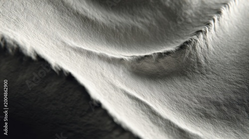 Abstract Texture of Sand Dune: A captivating aerial view unveils the mesmerizing patterns etched by wind and time on a vast expanse of textured sand dunes.