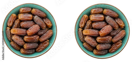 Two turquoise bowls filled with sweet dried brown dates isolated on a white background