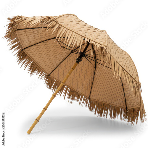 Tropical beach umbrella made of natural dried palm leaves with bamboo pole isolated on white