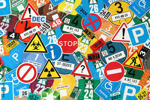 Pattern of traffic and road signs including warning symbols, Swiss and German vignettes
