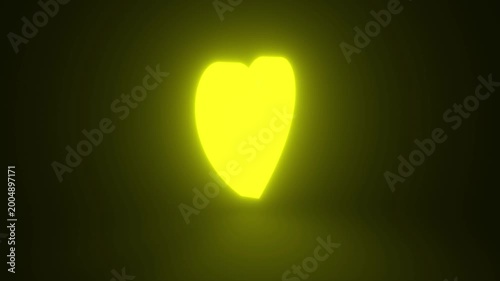 Yellow Heart, Symbol of Love and Valentine's Day Glowing and Rotating on Black Background