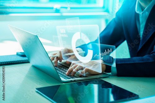 Картината върху платно Business professional using laptop with digital analytics dashboard, charts and data visualization,big data,representing business analytics,financial analysis and digital strategy performance concept