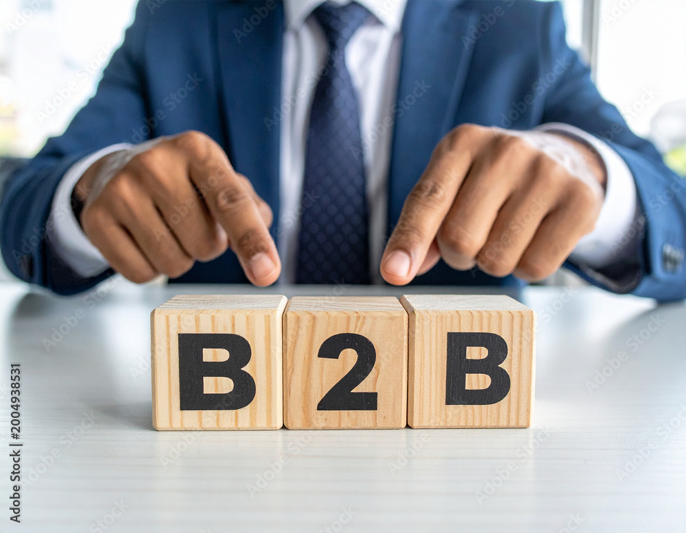 Obraz premium B2B - Geschäftsmann zeigt auf den Text 