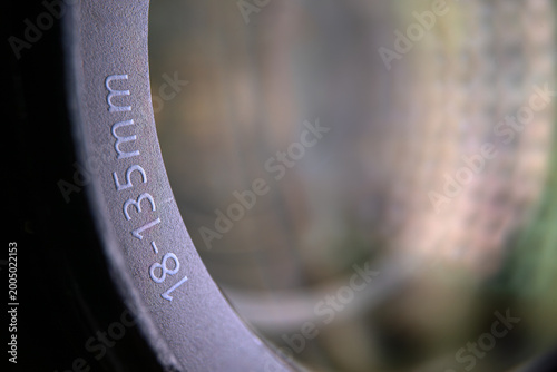 Schilderij op canvas Macro detail of focal length markings 18-135mm on professional camera lens