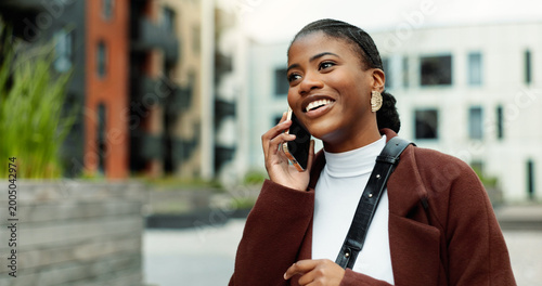 Konstfotografi Contact, business or black woman with phone call in city, settlement offer negotiation or case update