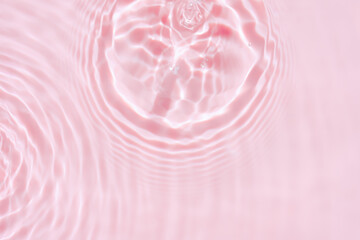 Pink water ripple texture background with soft light reflection and fluid waves. Abstract liquid pattern in pastel tone,Lxury backdrop for cosmetic branding, skincare design, beauty banner
