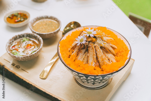 Fotografía Thai food spread with curry papaya salad and fresh vegetables on table