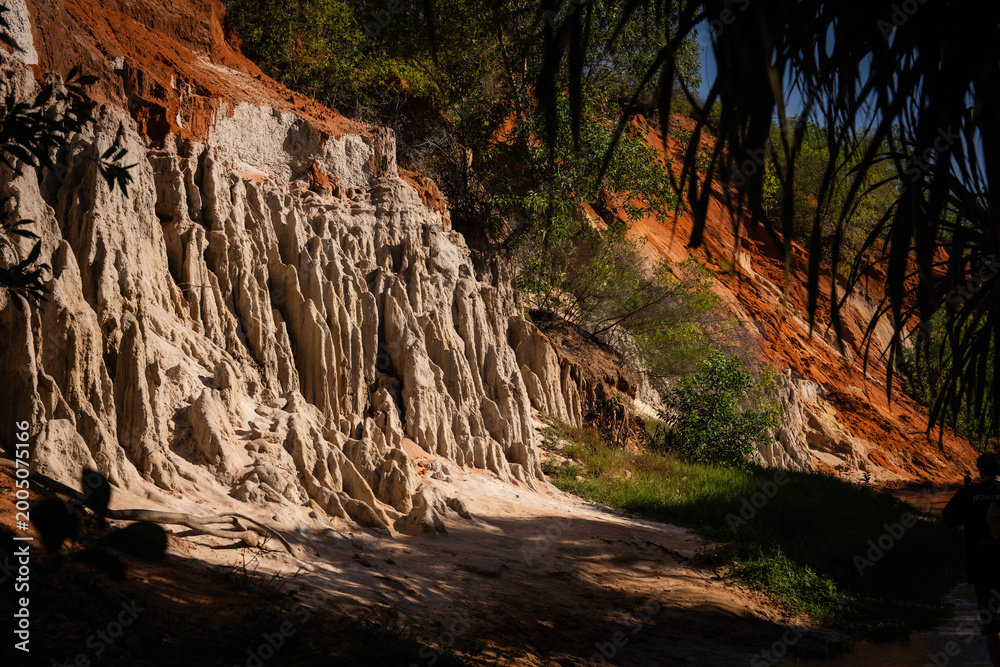 Fototapeta premium Stunning Eroded Landscape with Unique Geological Formations and Greenery
