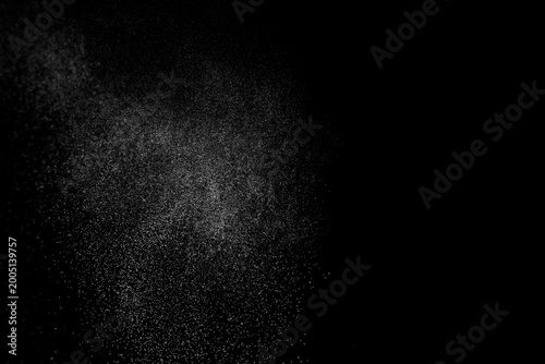Water spray mist particle abstract black background texture