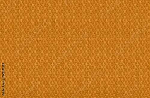 synthetic diamond ripstop fabric with geometric texture and rhombus pattern orange background