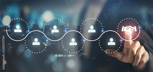 Digital Networking and Partnership Connection. Connecting digital user icons along network path, ending in a handshake icon. Collaboration, partnerships and relationship building in digital ecosystem.