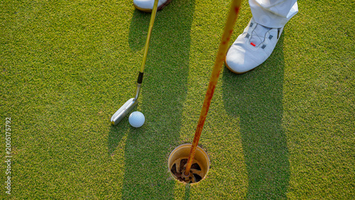 Golfers are putting golf in the evening golf course golf backglound.