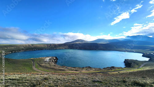 Schilderij op canvas Acıgöl in Karapınar, Konya is a volcanic maar lake formed by gas explosions, known for its deep, saline waters rich in magnesium sulfate, creating a striking crater landscape in Central Anatolia