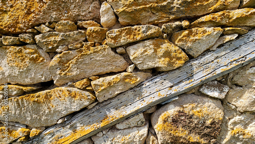 Cuadro en lienzo A traditional stone masonry wall with timber tie beams (hatıl system), commonly