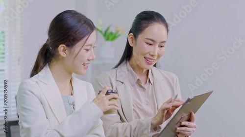 Tablets, meetings, and business people in the office.