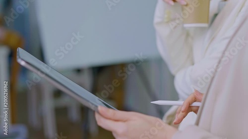 Tablets, meetings, and business people in the office.