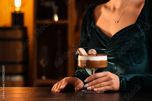 Woman with glass of tasty T...