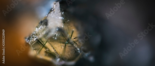 Macro image of prase green translucent quartz with actinolite needle inclusions from Sinyaya Rechka, Primorye, via microscope, 10x magnification, 3.6mm field of view