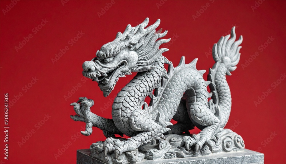 Fototapeta premium Intricate Stone Dragon Sculpture Against a Solid Red Background