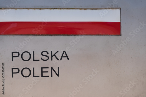 
POLISH-GERMAN BORDER - Marking the country with the national flag and the name written in Polish and German