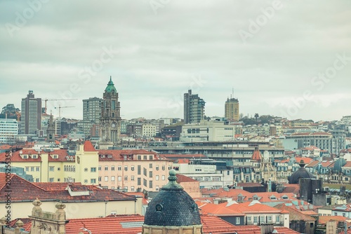 In the heart of Porto, vibrant rooftops reflect ongoing challenges. Tourists crowd the streets, while locals confront unaffordable housing and persistent noise from construction