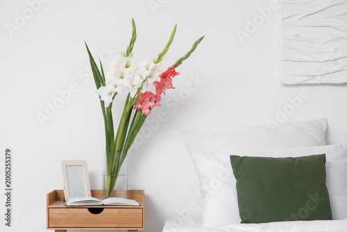 Vase with gladiolus flowers...