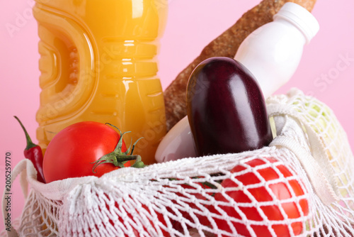 Mesh bag with vegetables an...