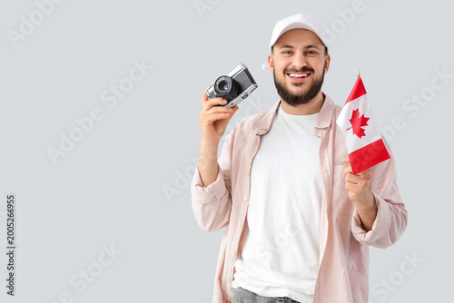 Young man with flag of Cana...