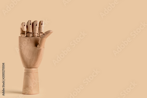 Wooden hand pointing at som...