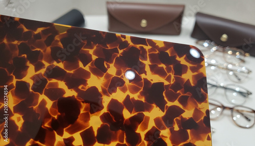 Polished Havana tortoiseshell acetate texture with backlit amber and brown pattern