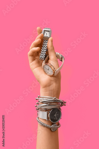 Female hand with wristwatch...
