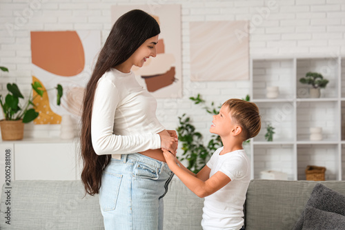 Pregnant woman and her son ...