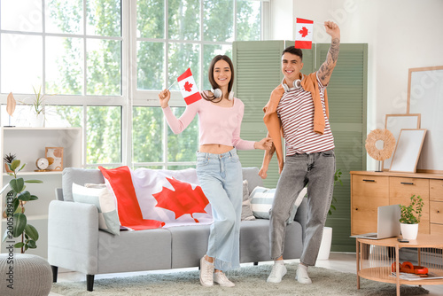 Young couple with flags of ...