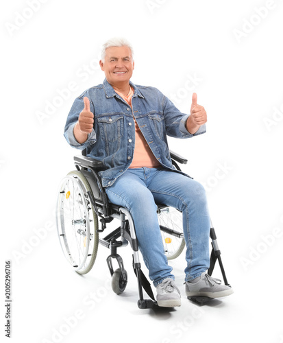 Mature man in wheelchair sh...
