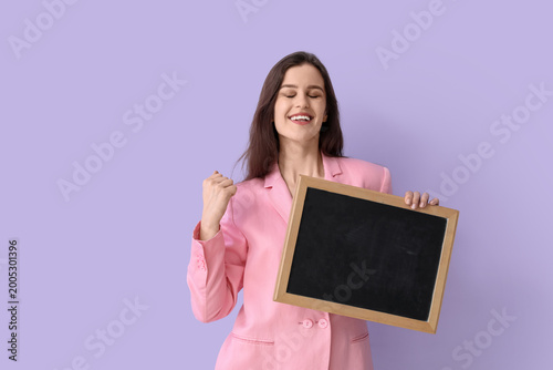 Happy female teacher with c...