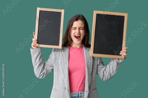 Female teacher with chalkbo...