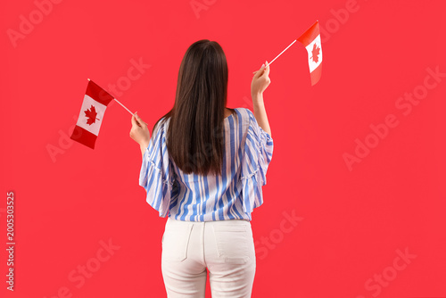 Young woman with flags of C...