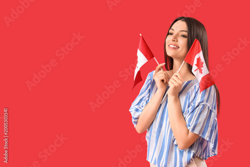 Young woman with flags of C...