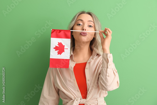 Funny young woman with flag...
